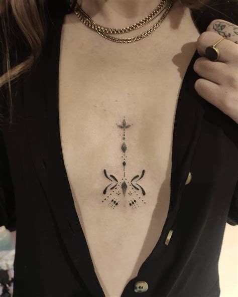 between boob tattoo ideas|Tattoo between breast: perfect tattoo ideas to。